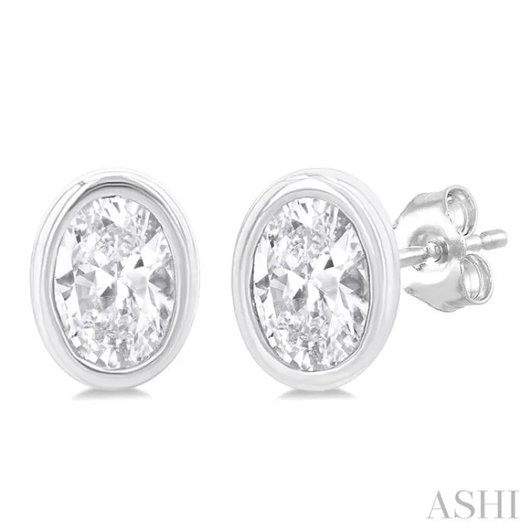 1/5 ctw Petite Bezel Set Oval Cut Diamond Fashion Stud Earring in 10K White Gold