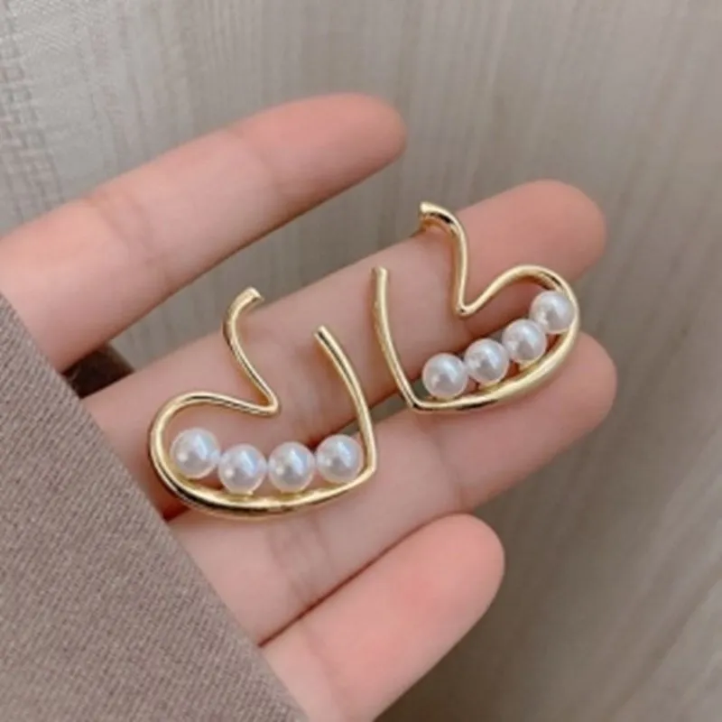 Gold plated heart pearl stud earrings